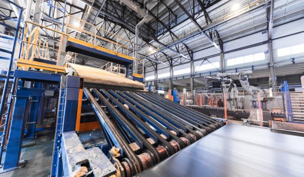 Modern operational plant equipment assembly line producing fiberglass batt heavy industry machinery metalworking workshop concept.