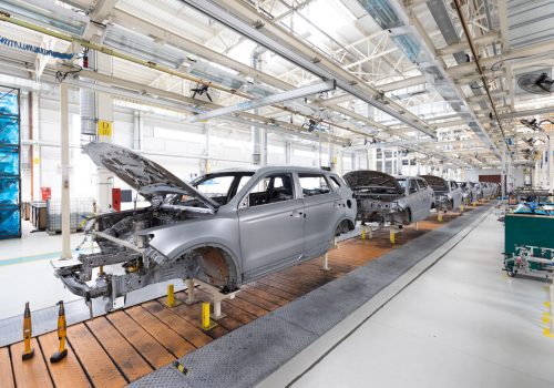 Plant for production of cars. Modern automotive industry. Electric car factory, conveyor.